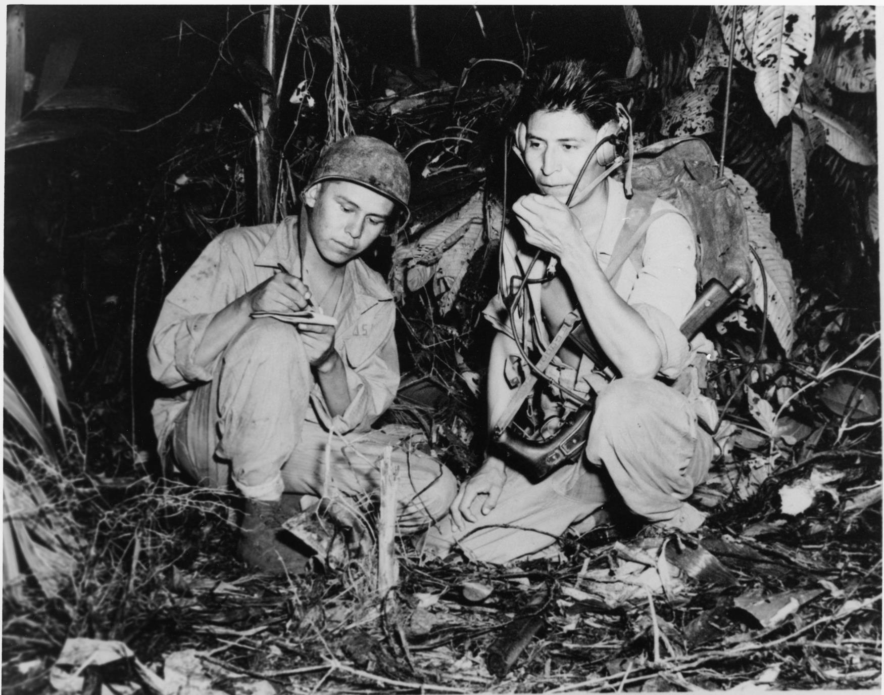 Diné [Navajo] code talkers Corporal Henry Bahe, Jr. and Private First Class George H. Kirk. Bougainville, South Pacific, December 1943. (Photo Credit: National Archives and Records Administration 127-MN-69889-B)