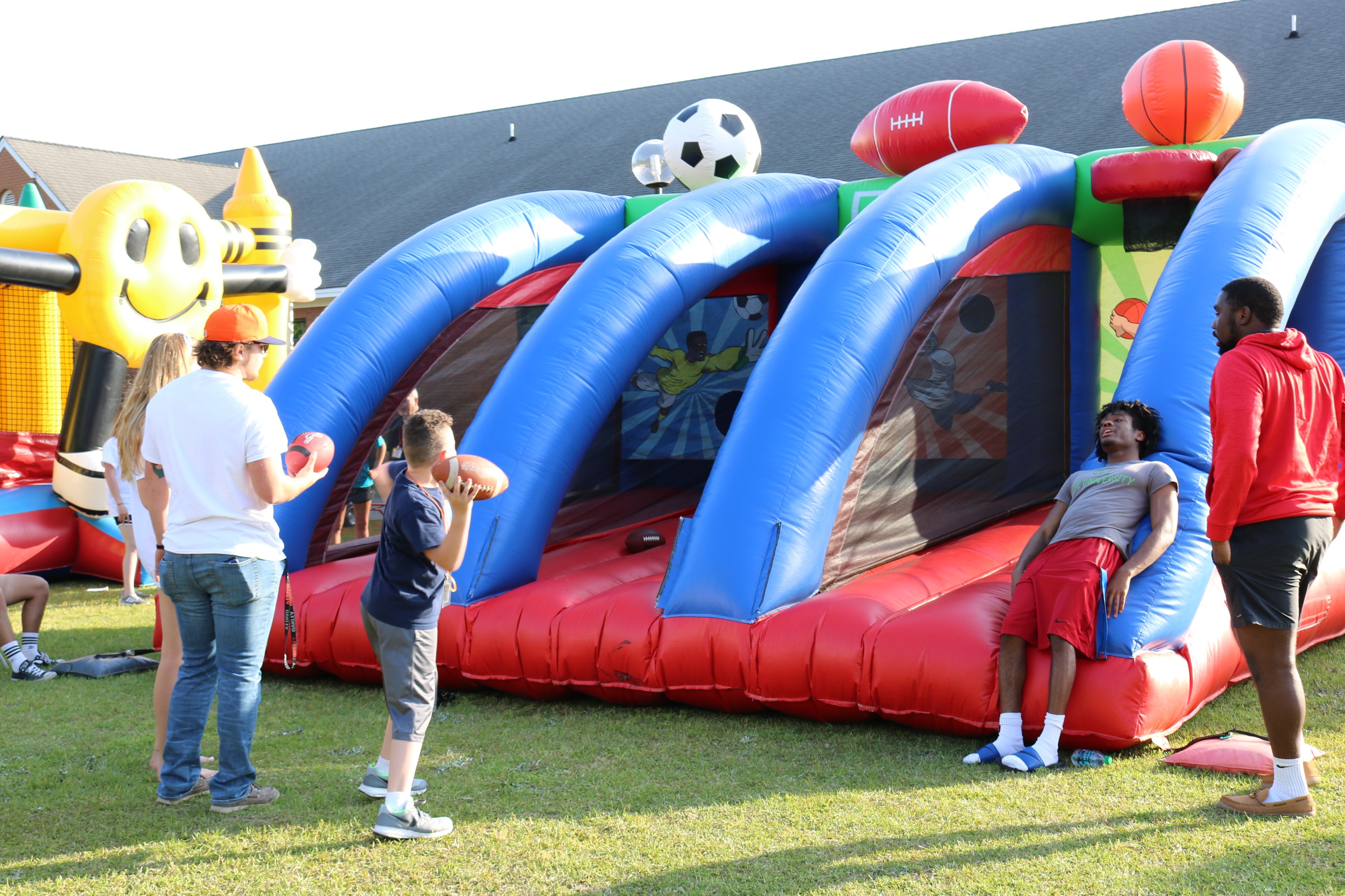 Brewton-Parker students played alongside alumni’s children with inflatables and a mechanical bull at the Family Fun BBQ on April 13. Photo Credit: Caitlyn Parrish