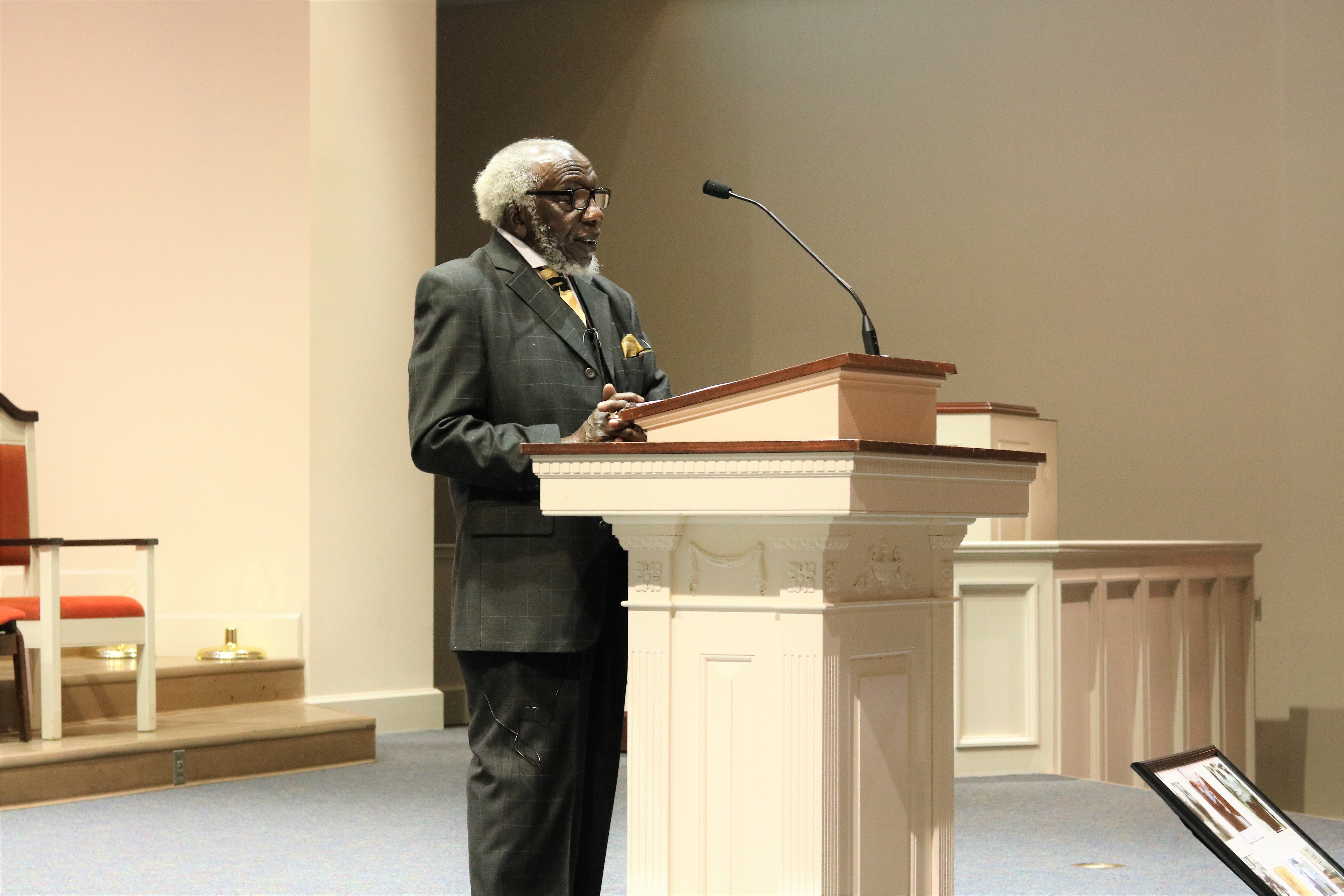 A Brewton-Parker student views a photo collage of Dr. F. Lee Carter’s ministry alongside Dr. Martin Luther King, Jr. Carter was the guest speaker at the April 3 Brewton-Parker chapel service, which honored the 50th anniversary of the assassination of MLK, Jr. Photo Credit: Morgan Page