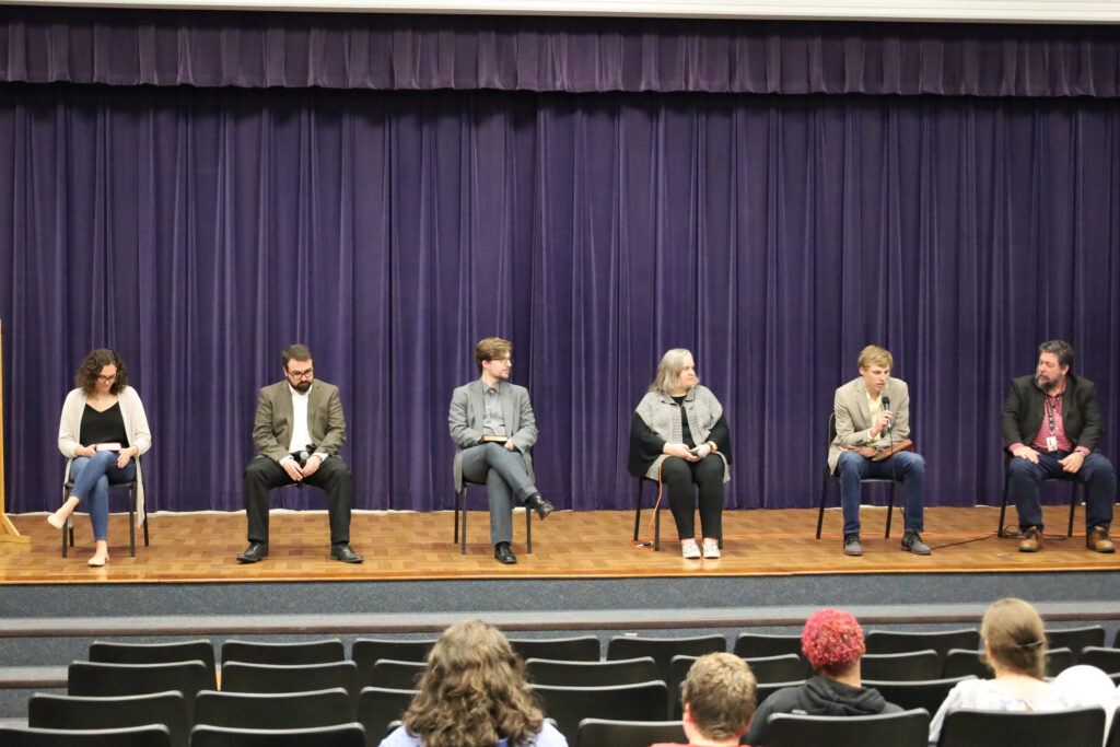 Panelists on a stage at Brewton-Parker College's Lion's Den Event